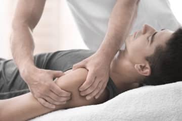 Active Release therapy on man's shoulder