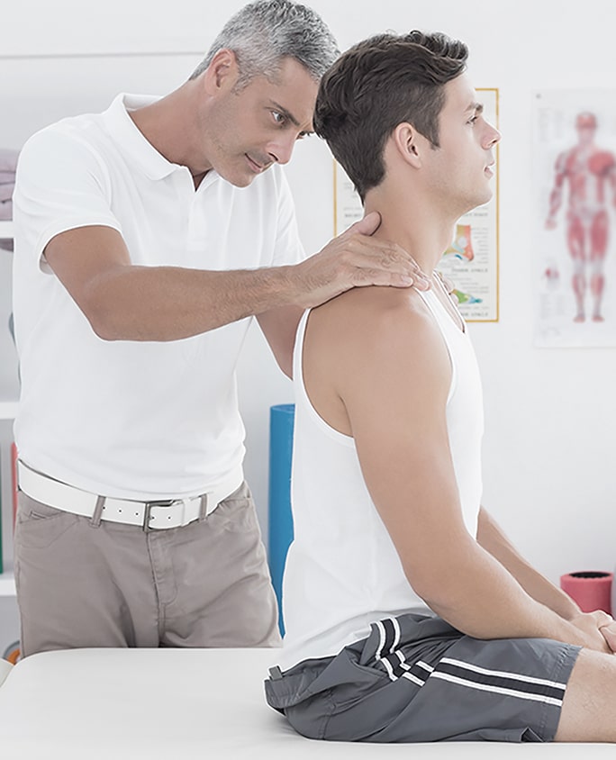 chiropractor adjusts back