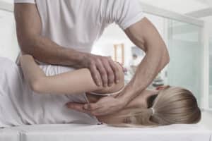 woman getting a chiropractic treatment for back pain