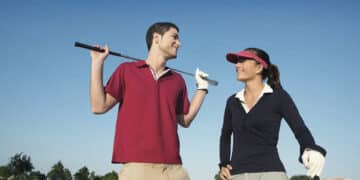 male and female golfers