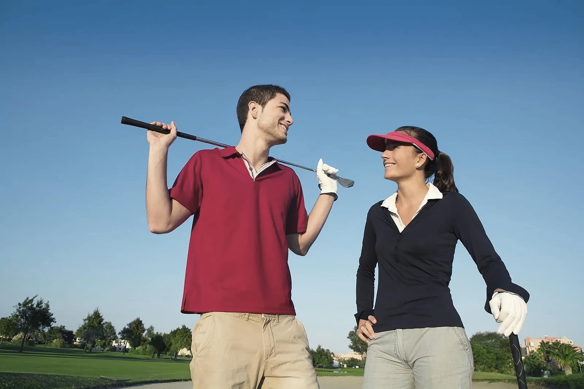 male and female golfers